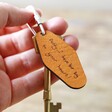 Model Holding Brown Personalised Handwriting Leather Tag Keyring with Gold Key