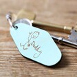 Green Personalised Handwriting Leather Tag Keyring with Keys on Wooden Table