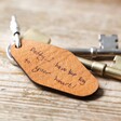 Brown Personalised Handwriting Leather Tag Keyring with Keys on Wooden Table