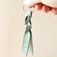 Model Holding Personalised Twisted Knot Leather Keyring in Mint Green
