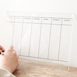 A4 Wipeable Acrylic Wall Planner Resting on Wooden Table