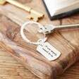 Silver Personalised Engraved Dog Tag Keyring on Table