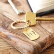 Gold Personalised Engraved Dog Tag Keyring on Table