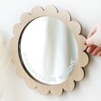 Model Arranging the Personalised Scallop Edge Wooden Mirror Against a White Wall