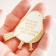 Model holding Wooden Robins Appear When Loved Ones Are Near Bird Token in palm of their hand