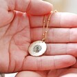 Model Holding Gold Personalised Birth Flower Antique Effect Pendant Necklace