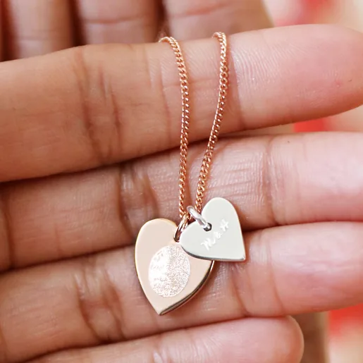 Model Holding Personalised Fingerprint Sterling Silver Double Heart Pendant Necklace