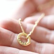 Model Holding Gold Personalised Organic Hoops Necklace