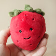 Model Holding Jellycat Small Fabulous Fruit Strawberry Soft Toy