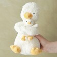 Model Holding Jellycat Huddles Duck Soft Toy
