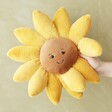 model holding Jellycat Large Fleury Sunflower Soft Toy