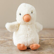 Jellycat Nippit Duck Soft Toy on Wooden Surface