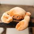 Jellycat Sensational Crab Soft Toy on Wooden Surface
