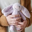 Model Holding Jellycat Small Bashful Lilac Bunny Soft Toy