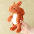 Model holding Jellycat Tumbletuft Squirrel Soft Toy