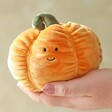 model holding Jellycat Vivacious Vegetable Pumpkin Soft Toy