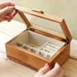 Model Lifting the Lid on the Medium Glass Top Wooden Jewellery Box