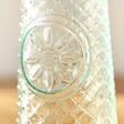 Close Up of Small Textured Tapered Glass Vase