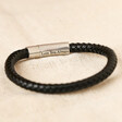 engraved men's leather valentine's bracelet in black on pale textured background