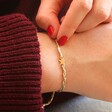 Model Wearing Woven Friendship Bracelet with Gold Star