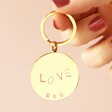 Model Holding Personalised Love Stainless Steel Disc Keyring in Gold