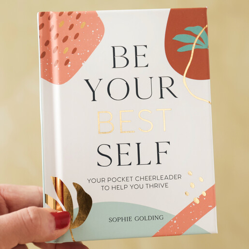 Model Holding Be Your Best Self Book