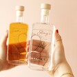 Model Holding Personalised Pair of 20cl Heart Outline Couples' Spirits with Alcohol Inside