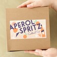 Model Holding Aperol Spritz Cocktail Kit