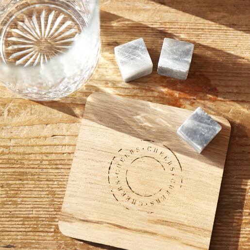 Glass, Whisky Stones and Coaster Etched glass, 3 whisky stones and wooden coaster shot from above