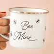 Model Holding Unique Bee Mine White Enamel Mug