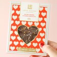 Model Holding Love Cocoa Salted Caramel 41% Milk Chocolate Bar