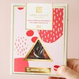 Model Holding Love Cocoa Sour Cherry and Strawberry Dark Chocolate Bar