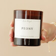 Model Holding Lisa Angel Peony Scented Soy Candle
