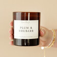 Model Holding Lisa Angel Plum and Rhubarb Scented Soy Candle