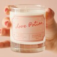 Model Holding Love Potion Scented Soy Valentine's Day Candle
