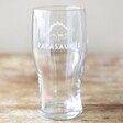 Papasaurus Pint Glass on Wooden Table