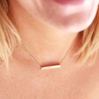 Close Up of Personalised Solid Gold Horizontal Bar Necklace on Model