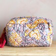 Quilted Grey Floral Make Up Bag on Table