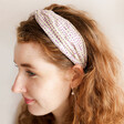 side profile of model wearing Purple Polka Dot Twist Fabric Headband