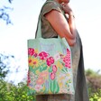 Close Up of Powder Mint Green Country Garden Tote Bag on Model