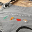 Close Up of Personalised Embroidered Birth Vegetable Grey Apron