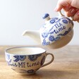 Model Holding Teapot from Sass & Belle Blue Willow Tea For One Teapot and Cup Set