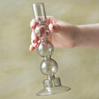 model holding Sass & Belle Bubble Candlestick Holder in Grey
