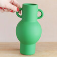 Model Holding Sass & Belle Large Amphora Vase in Apple Green