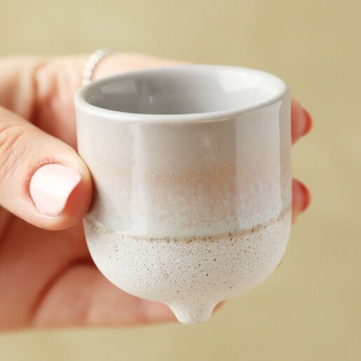 Model holding Sass & Belle Mojave Glaze Grey Egg Cup