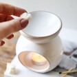 Model Putting Wax Melts into Sass & Belle Moon Phases Oil Burner