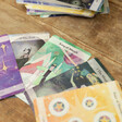 Tarot Cards from The Moon & Stars Tarot Card Deck on Wooden Surface
