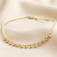 Beaded Ball Charm Anklet in Gold on Beige Fabric