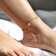 Model Wearing Beaded Daisy Satellite Chain Anklet in Gold
