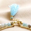 close up of tassel and extender chain on Semi-Precious Stone Bead and Chain Anklet in Pastel Blue